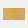 Gold doormat with a plain background