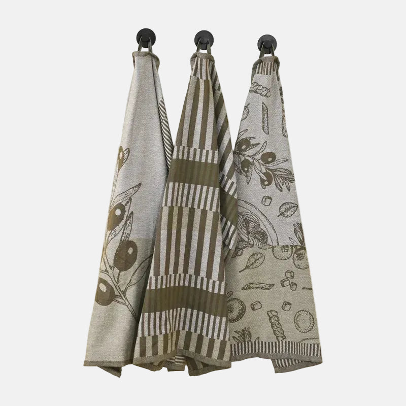 Three patterned towels hanging on a rack against a white background