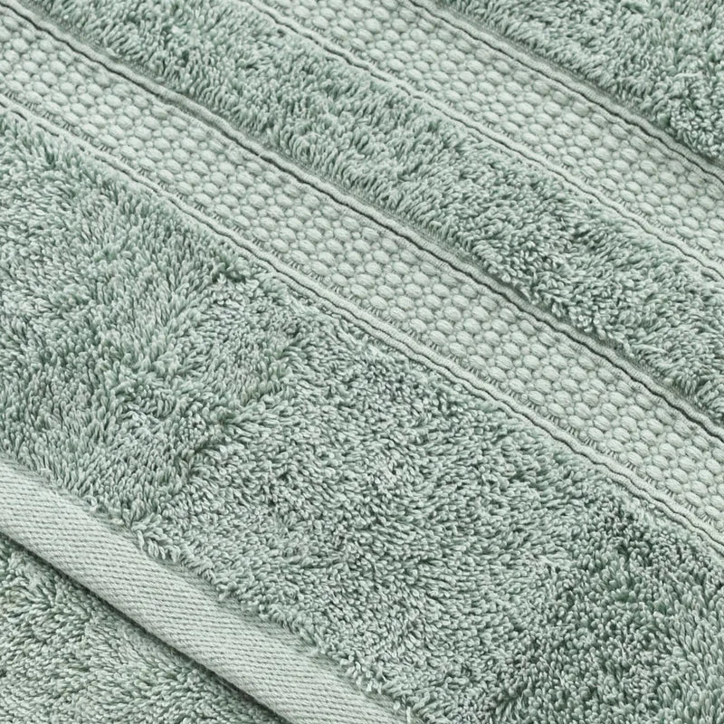 Close-up of green textured fabric with horizontal stripes