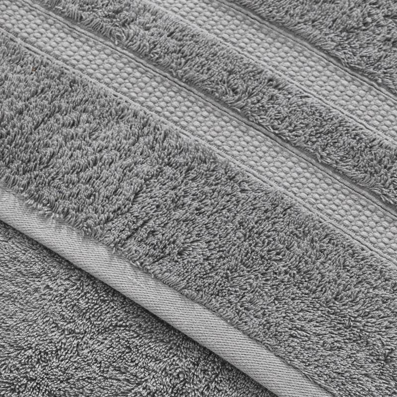 Close-up of gray bath towels with texture and color variations.