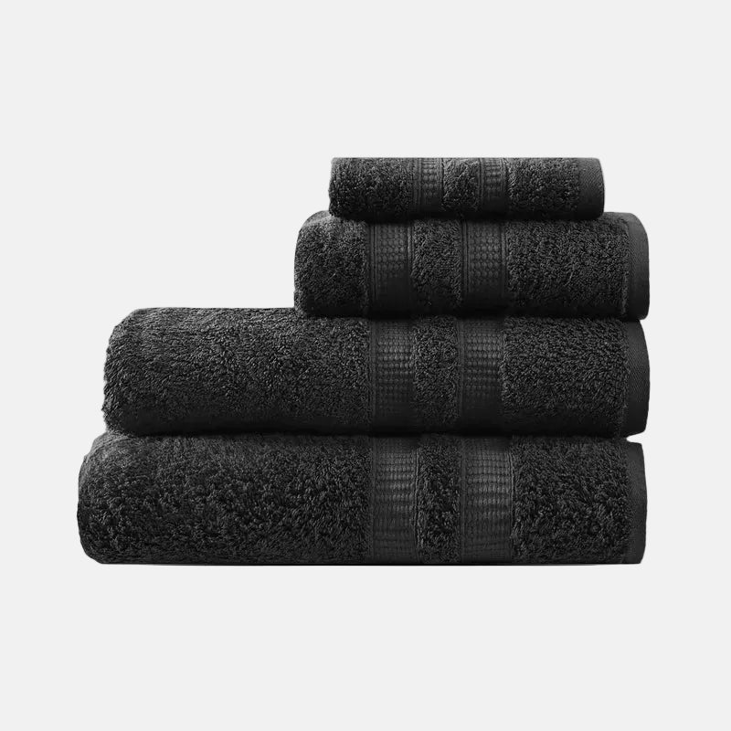 Stack of black towels on a white background