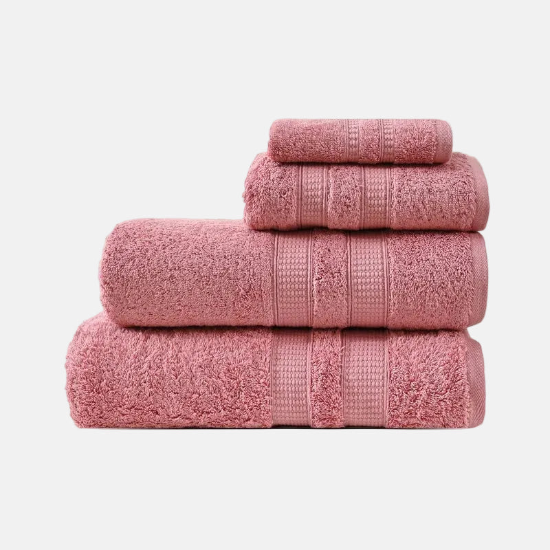 Stack of pink towels on a white background