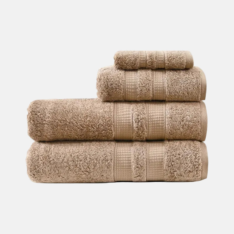 Stack of beige towels on a white background